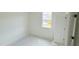 Bedroom featuring a large window, neutral walls, and a closet door at 158 Gobbler Dr, Smithfield, NC 27577