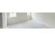Bedroom with neutral walls, and a large window providing natural light at 158 Gobbler Dr, Smithfield, NC 27577