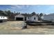 New construction home featuring a covered entrance, open garage and front yard with gravel at 158 Gobbler Dr, Smithfield, NC 27577