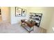 Functional home office featuring a wooden desk, stylish shelving unit, neutral walls, and natural light creating a productive atmosphere at 158 Gobbler Dr, Smithfield, NC 27577