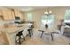 Spacious kitchen with granite counters, stainless appliances, open to dining area with outdoor access at 158 Gobbler Dr, Smithfield, NC 27577