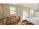 View of the unfinished kitchen area with wood cabinets and a window overlooking the backyard at 158 Gobbler Dr, Smithfield, NC 27577