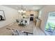 Open concept kitchen and dining area with modern lighting and stainless steel appliances at 158 Gobbler Dr, Smithfield, NC 27577