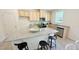 Bright kitchen boasts granite countertops, stainless appliances, and an island with seating at 158 Gobbler Dr, Smithfield, NC 27577