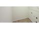 Neat laundry room with vinyl floors and wire shelving at 158 Gobbler Dr, Smithfield, NC 27577