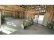 Spacious open-concept living room showcasing unfinished walls and ceiling and open doorway at 158 Gobbler Dr, Smithfield, NC 27577