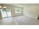 Spacious living room filled with natural light and carpeted floors at 158 Gobbler Dr, Smithfield, NC 27577