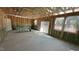 Spacious living room with a sliding glass door and several windows for natural light at 158 Gobbler Dr, Smithfield, NC 27577