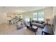 Inviting living room flows into the kitchen, filled with natural light and stylish furnishings at 158 Gobbler Dr, Smithfield, NC 27577