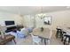 Open concept living area featuring dining table, seating, and seamless flow between living spaces at 158 Gobbler Dr, Smithfield, NC 27577