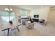 Spacious living room with dining area and modern decor, perfect for entertaining and relaxation at 158 Gobbler Dr, Smithfield, NC 27577