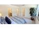 Bright main bedroom with an ensuite bathroom and walk-in closet, featuring neutral walls and a comfortable striped bedspread at 158 Gobbler Dr, Smithfield, NC 27577