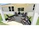 Covered outdoor patio space with four Adirondack chairs is perfect for relaxing and entertaining at 158 Gobbler Dr, Smithfield, NC 27577
