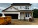 Two-story home under construction with an attached two-car garage and a black shingle roof at 183 W Saltgrass Ln, Smithfield, NC 27577
