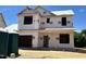 New construction home with WILD branding wrap waiting for siding and finishing touches at 189 W Saltgrass Ln, Smithfield, NC 27577