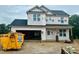 New construction home featuring a modern design and a spacious two-car garage in a residential neighborhood at 189 W Saltgrass Ln, Smithfield, NC 27577