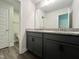 Contemporary bathroom featuring a double sink vanity with granite countertop and modern fixtures at 201 W Saltgrass Ln, Smithfield, NC 27577