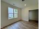 Bright bedroom with plush carpeting, neutral walls, and a window offering natural light and neighborhood views at 211 W Saltgrass Ln, Smithfield, NC 27577
