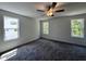 Bedroom with ceiling fan and multiple windows letting in plenty of light at 211 W Saltgrass Ln, Smithfield, NC 27577