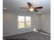 Comfortable bedroom with a ceiling fan and a window with natural sunlight at 211 W Saltgrass Ln, Smithfield, NC 27577