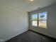 Bedroom with carpeted floor, window and electrical outlet at 211 W Saltgrass Ln, Smithfield, NC 27577