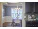 Elegant dining room showcasing wainscoting, a chandelier, and a window with a view at 215 Strolling Way, Durham, NC 27707
