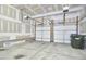 Spacious two car garage featuring concrete floors and automatic doors, ready for vehicles and storage solutions at 215 Strolling Way, Durham, NC 27707