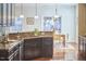 Beautiful kitchen featuring wood cabinets, modern appliances, and a view into the dining area at 215 Strolling Way, Durham, NC 27707