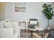 Cozy living room with a comfortable sofa, armchairs, and a stylish coffee table on a rug at 215 Strolling Way, Durham, NC 27707