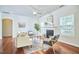 A bright living room features hardwood floors, a fireplace, and modern furnishings, creating a welcoming space at 215 Strolling Way, Durham, NC 27707