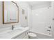Clean bathroom with white subway tile, a shower-tub, and bright vanity with modern fixtures at 22 Hill Row Ln, Clayton, NC 27527