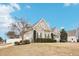 This home features an attached two-car garage and manicured shrubbery at 22 Hill Row Ln, Clayton, NC 27527