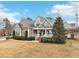 Elegant two-story home featuring a welcoming front porch and beautifully landscaped front yard at 22 Hill Row Ln, Clayton, NC 27527
