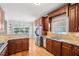 This kitchen features wood floors, granite counters, stainless appliances, and cherry cabinets at 22 Hill Row Ln, Clayton, NC 27527