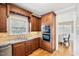 This kitchen features wood floors, granite counters, stainless oven appliances, and cherry cabinets at 22 Hill Row Ln, Clayton, NC 27527