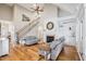 Spacious living room with a cozy fireplace, high ceilings, and hardwood floors at 22 Hill Row Ln, Clayton, NC 27527