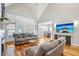 Open concept living room with a fireplace, hardwood floors, and adjacent dining area at 22 Hill Row Ln, Clayton, NC 27527