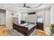 This bedroom offers an expansive layout with high ceilings, wood floors, and lots of natural light at 22 Hill Row Ln, Clayton, NC 27527