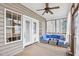 Screened porch with outdoor seating, ceiling fan, curtains, and access to the outdoors at 22 Hill Row Ln, Clayton, NC 27527