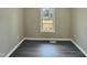 This cozy bedroom with a window overlooking the backyard is the perfect retreat after a long day at 2412 Little John Rd, Raleigh, NC 27610