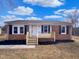 Charming single-story brick home with a cozy front porch and newly landscaped yard at 2412 Little John Rd, Raleigh, NC 27610