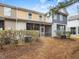 The back of the townhome has a small yard, patio and screened porch for outdoor enjoyment at 2459 Memory Ridge Dr, Raleigh, NC 27606