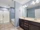 Bathroom featuring a shower, soaking tub, double vanity and neutral tile floors at 2459 Memory Ridge Dr, Raleigh, NC 27606