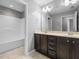 Bright bathroom features a double sink vanity with modern fixtures and a shower-tub combination at 2459 Memory Ridge Dr, Raleigh, NC 27606