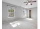 Bright bedroom with neutral carpet, two windows and ceiling fan with vaulted ceilings at 2459 Memory Ridge Dr, Raleigh, NC 27606