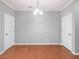 Simple dining room with hardwood floors, grey walls, and white doors at 2459 Memory Ridge Dr, Raleigh, NC 27606