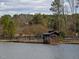 Lakeside gazebo on a dock featuring an area for lounging with water access, and enhanced by serene water views at 2459 Memory Ridge Dr, Raleigh, NC 27606