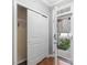 Bright entryway showcasing hardwood floors, a coat closet, and a clear view to the front door at 2459 Memory Ridge Dr, Raleigh, NC 27606