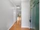 Welcoming entryway featuring gleaming hardwood floors, neutral paint, and a view of the living spaces at 2459 Memory Ridge Dr, Raleigh, NC 27606