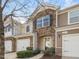 Desirable townhouse featuring stylish stonework, private garage, and verdant curb appeal at 2459 Memory Ridge Dr, Raleigh, NC 27606